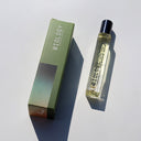 Biology Balance Rollerball Perfume and box laid flat on white background