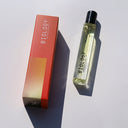 Biology Deep Rollerball Perfume and box laid flat on white background