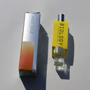 Biology Elysian Rollerball Perfume and box shown from an angled top-down view