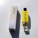Biology Flow Rollerball Perfume and box shown from an angled top-down view