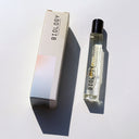 Biology Flow Rollerball Perfume and box laid flat on white background