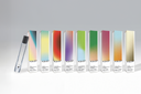 Row of Colory product boxes with gradient colors on a gray background
